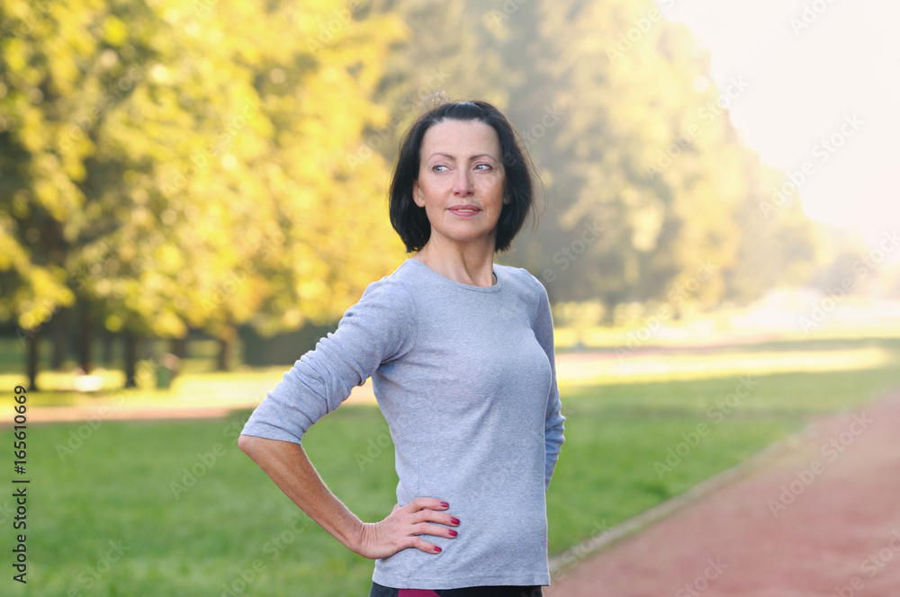 Portrait of mature woman before or after jog in the park Portrait of mature woman before or after jog in the park