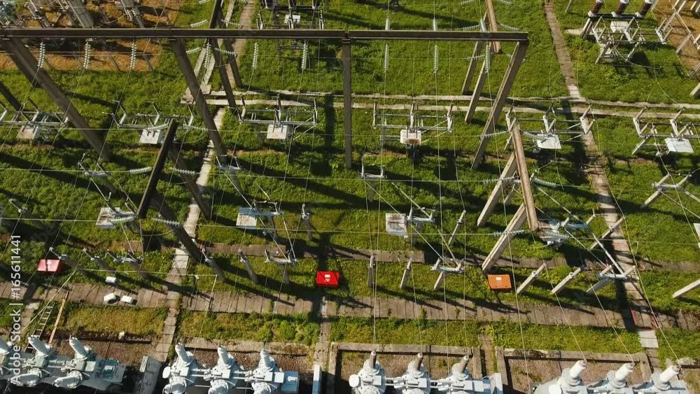 Aerial view Power plant, transformation station, cables and wires. High voltage electric power substation. Electrical power transformer in high voltage substation, 4K, aerial footage. Aerial view Power plant, transformation station, cables and wires. High voltage electric power substation. Electrical power transformer in high voltage substation, 4K, aerial footage.