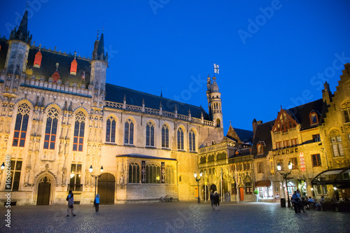 Square in Bruges city center at evening, Belgium