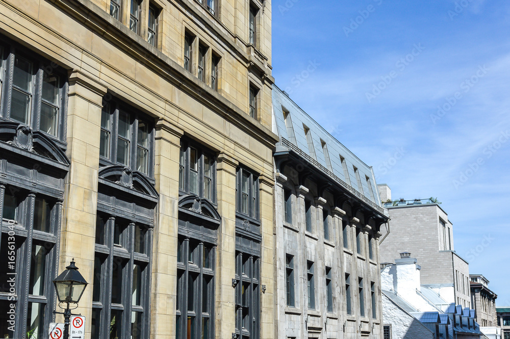 An old historical building with the large windows in the old port of Montreal, Canada