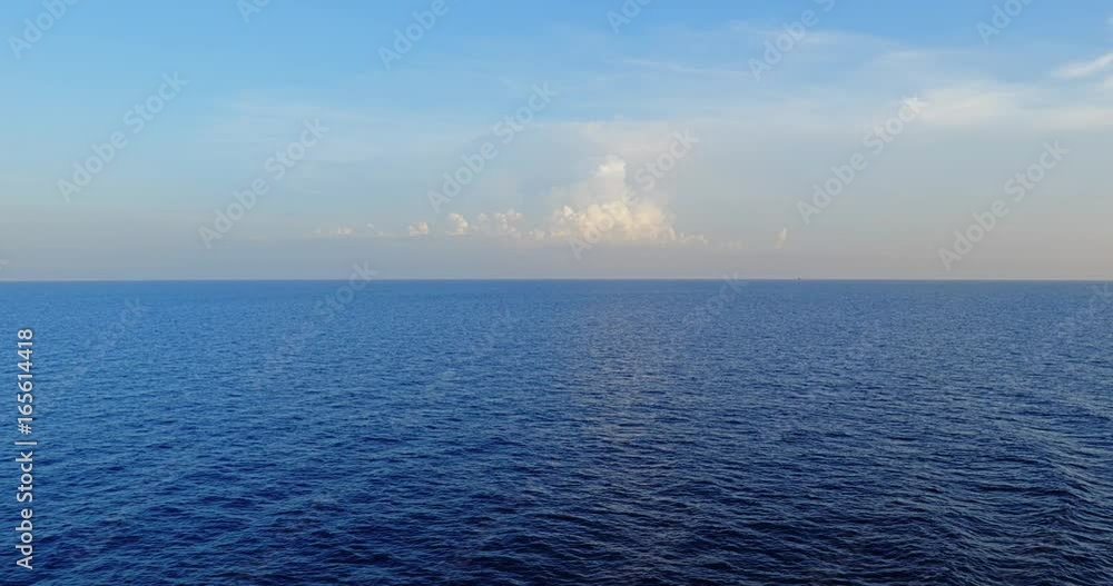 A peaceful sunset view of the horizon over the open ocean. Shot at 48fps. A peaceful sunset view of the horizon over the open ocean. Shot at 48fps.