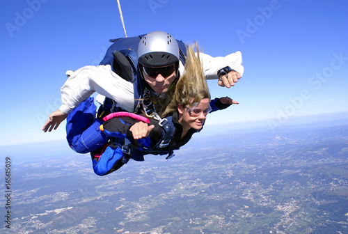Skydiving tandem having fun