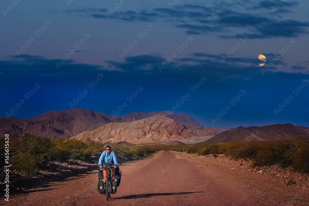Woman cycling at night