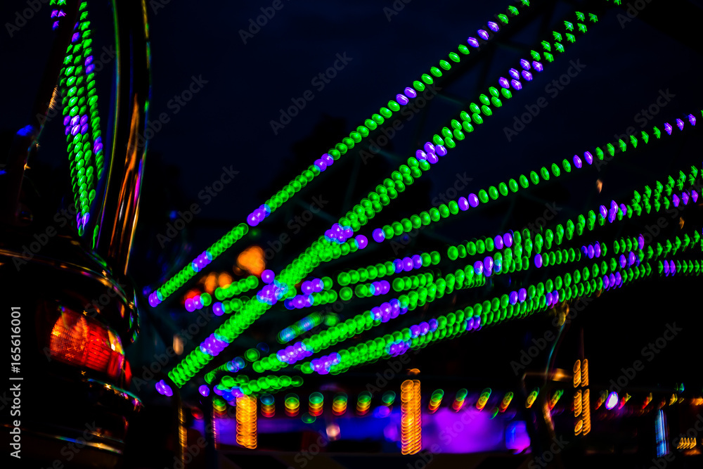 funfair impression with colorful light bokeh background