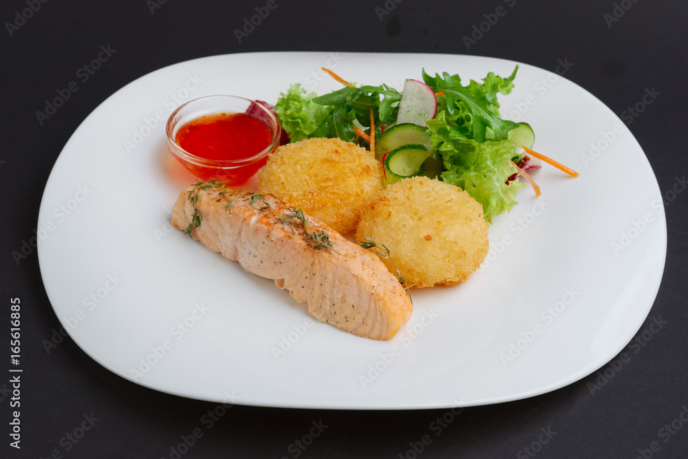 Fried salmon with rice cutlet and spicy sauce