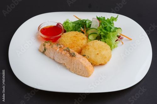 Fried salmon with rice cutlet and spicy sauce