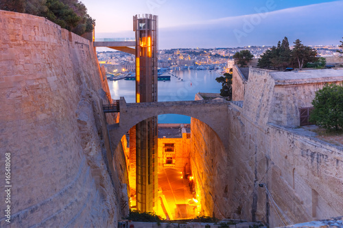 Upper Barrakka Lift, from Grand Harbour to Upper Barrakka Gardens, during morning blue hour, Valletta, Malta