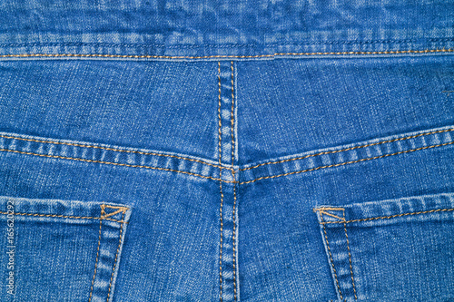 Fragment of clothing blue denim backside with pockets