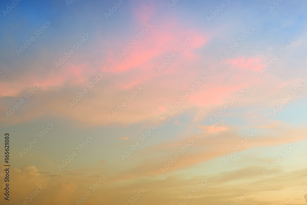 Beautiful abstract sky with pink and yellow clouds