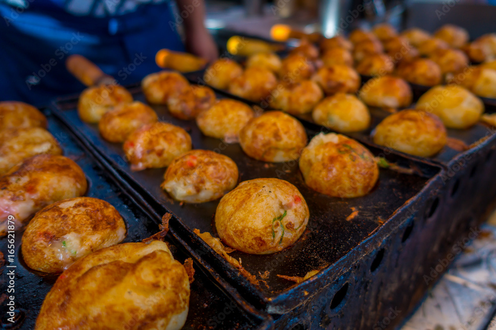 Close up of fried food located in a public market at Dotonbori district at Osaka Japan