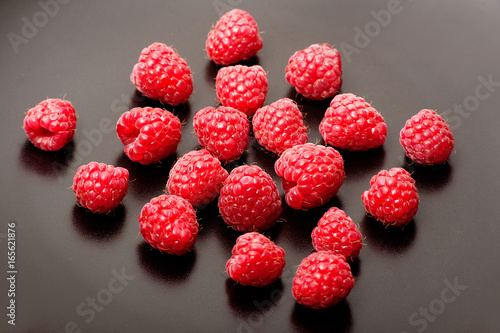 Fresh raspberries on black background