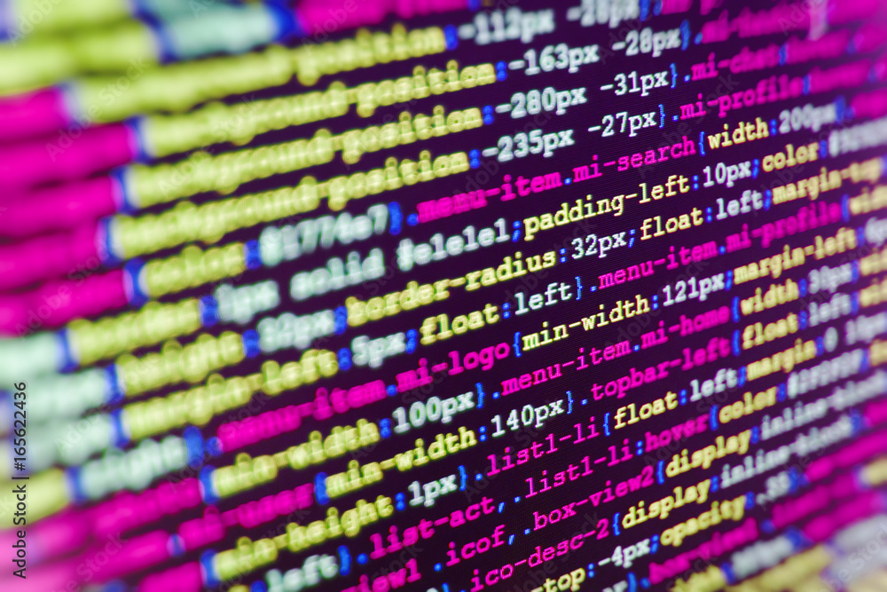 Programmer typing new lines of HTML code. SEO concepts for better SERP