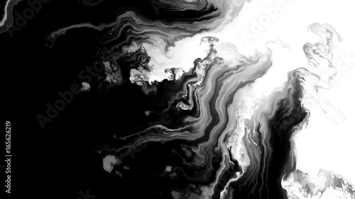 Black ink flowing on white background photo