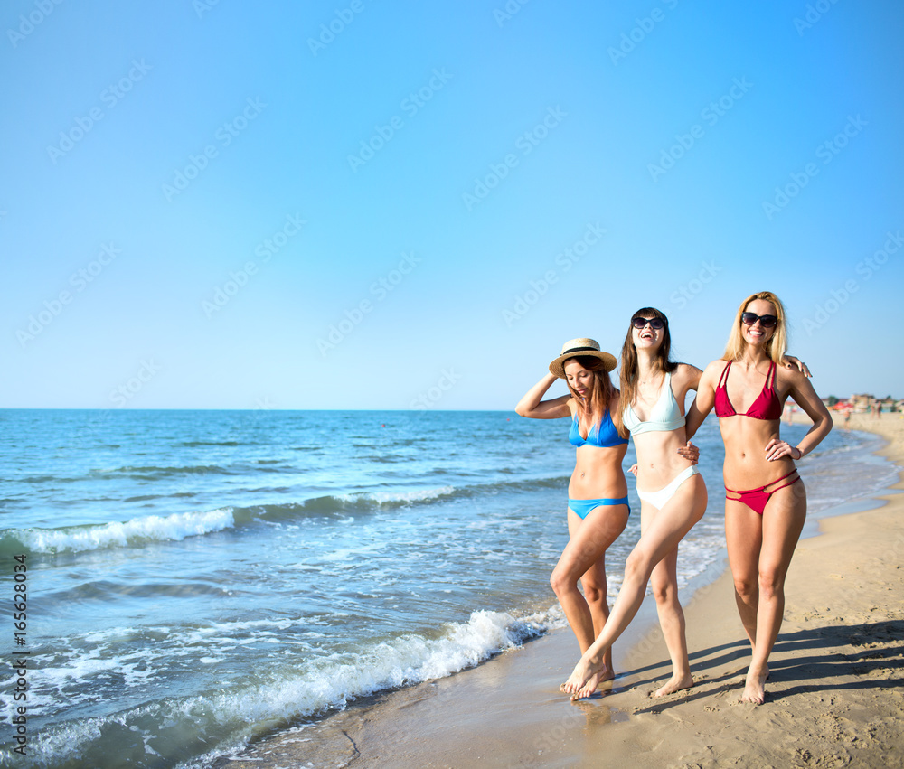 Group of happy friends having fun at ocean beach Group of happy friends having fun at ocean beach