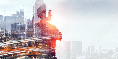 Photos Builder man against cityscape
