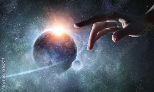 Touching planet with finger