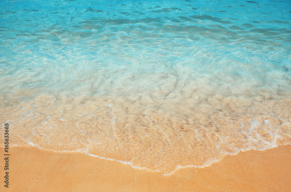 soft wave at the sea and sandy beach in summer time soft wave at the sea and sandy beach in summer time