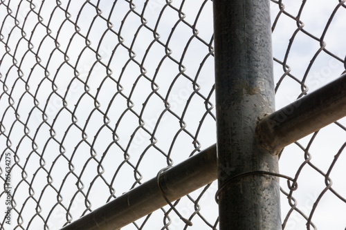 Lonely Clouds through Chainlink Fence The clouds are too lovely to be stuck behind this chainlink fence today! They do look a lot more interesting this way, though. Great for a fence effect!