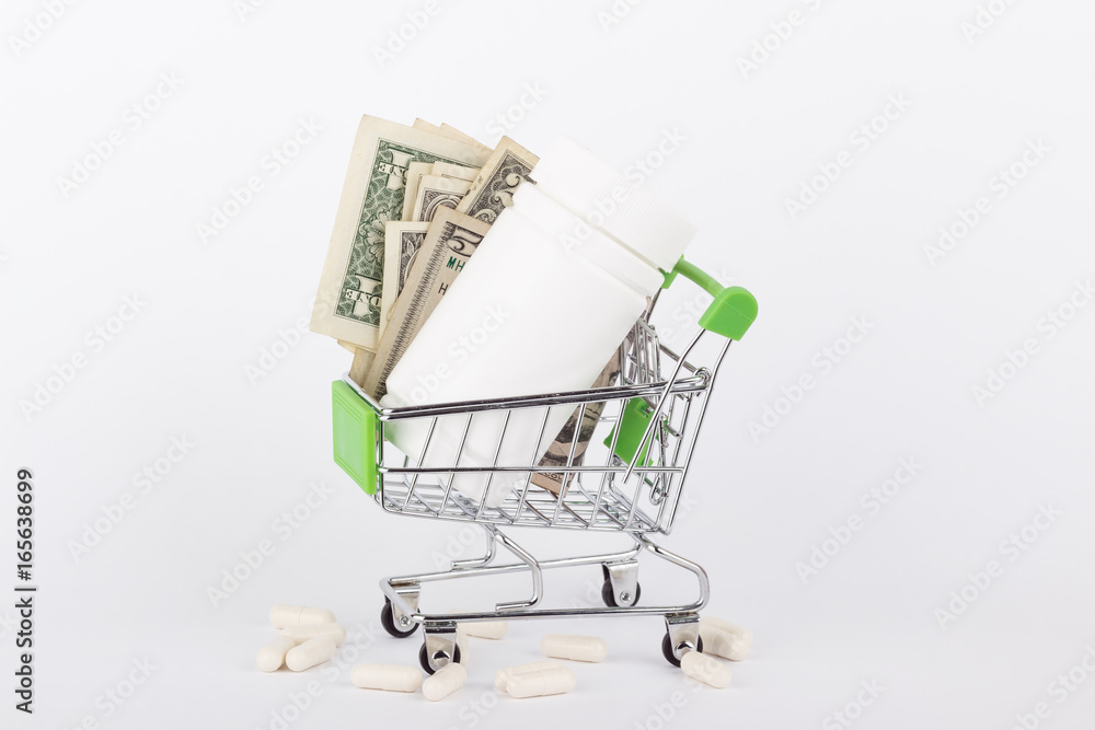 American dollars in the shopping pushcart, isolated