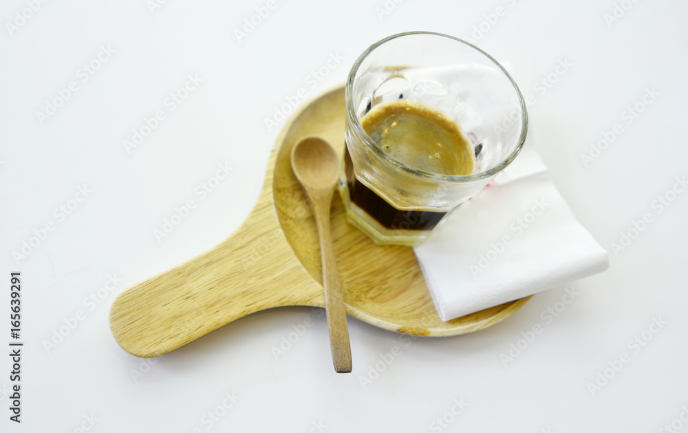 Black coffee shot mix sweetened condensed milk in glass on the white background Black coffee shot mix sweetened condensed milk in glass on the white background