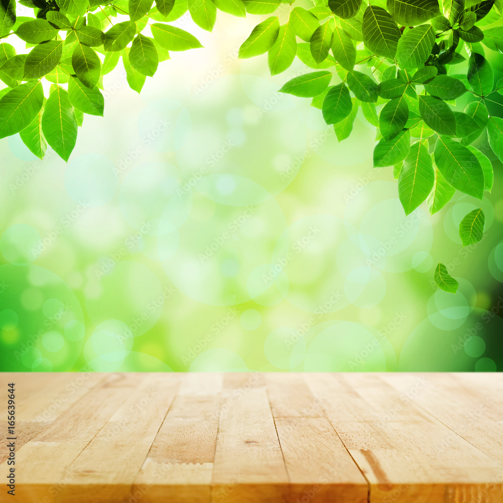 Wood table top with bokeh green nature abstract background Wood table top with bokeh green nature abstract background