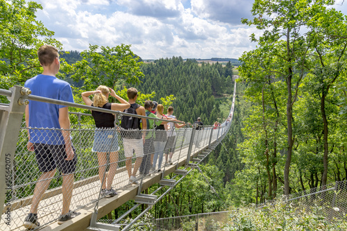 Moersdorf, Rhineland-Palatinate/ Germany July 18 2017: Germany's largest suspension bridge Geierlay in Moersdorf at Hunsrueck mountains photo