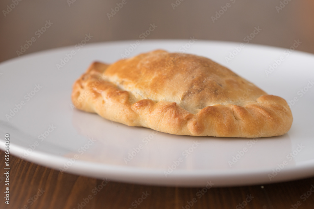 vegetable pasty on a white plate