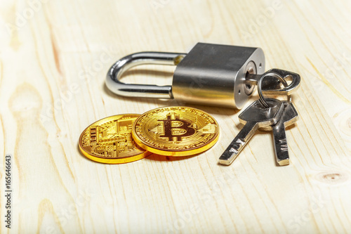 Gold bitcoin and padlock