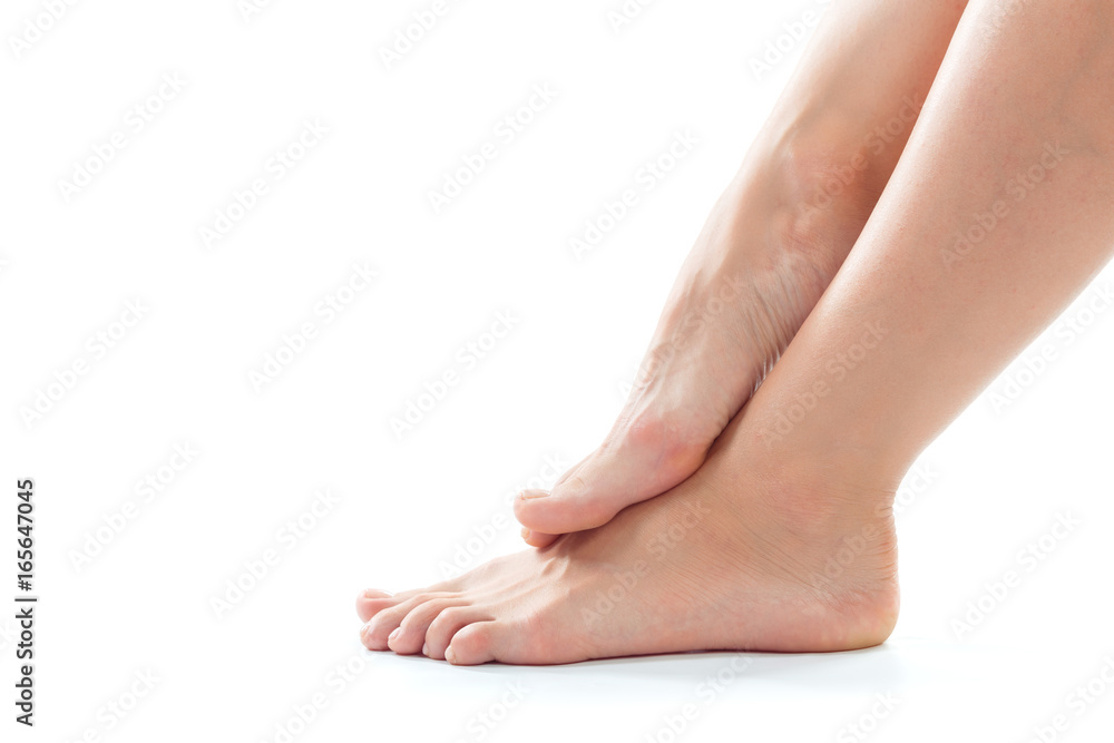 Beautiful women feet isolated on white close-up Beautiful women feet isolated on white close-up