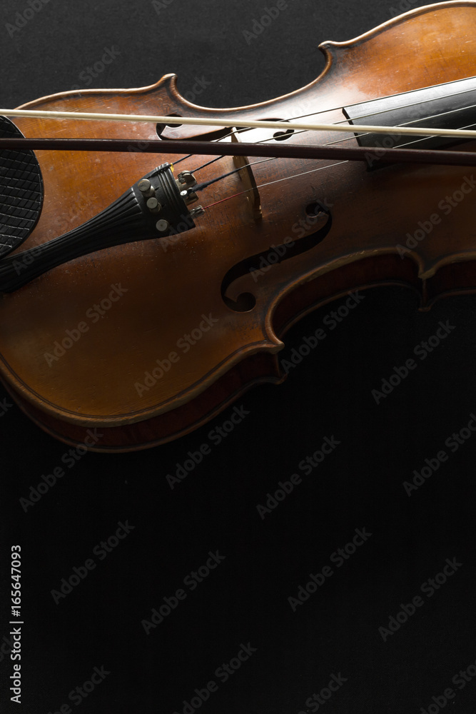 Fototapeta premium Old violin on a black background