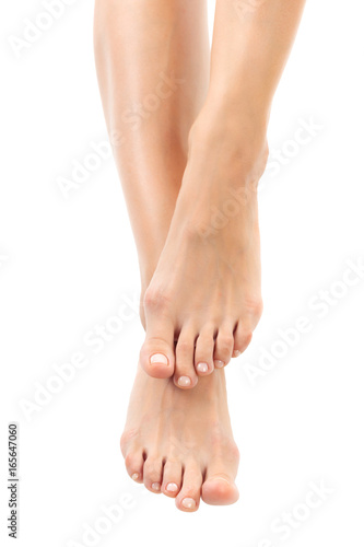 Beautiful women feet isolated on white close-up