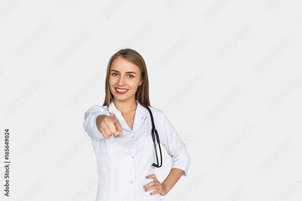 Doctor pointing at camera on white