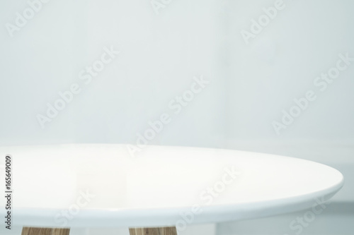 Close up empty white round clean table top with blur white background,Food stall display mockup for product,Backdrop for advertise campaign