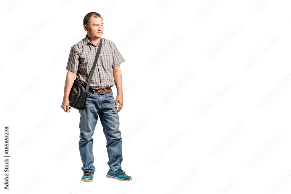 Portrait of a happy mature man standing in scott shirt and blue jeans looking to the right side. Isolated full length on white background with copy space and clipping path Portrait of a happy mature man standing in scott shirt and blue jeans looking to the right side. Isolated full length on white background with copy space and clipping path