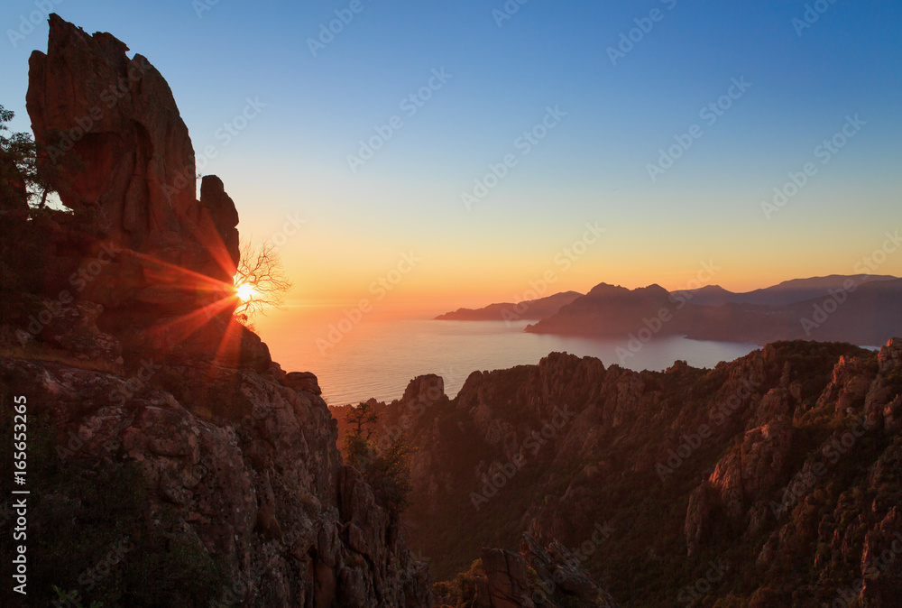 Cliffs of the famous Calanche and the Golf of Porto at the island of Corsica, France, during sunset.