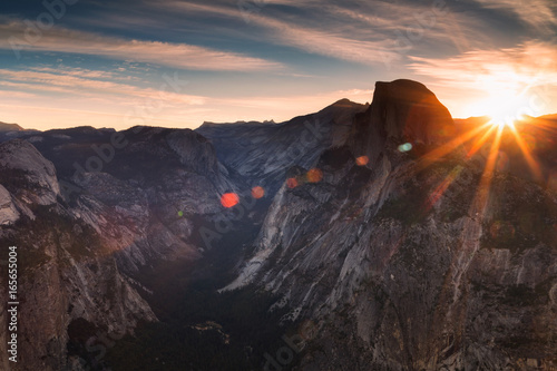 Half Dome rock climbing summits in beautiful golden light at sunset in summer, Yosemite National Park, California, USA