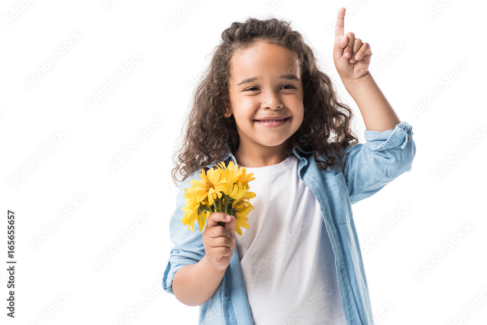 happy african american girl holding yellow flowers and pointing up with finger isolated on white happy african american girl holding yellow flowers and pointing up with finger isolated on white