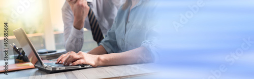 Businesswoman using a laptop, light effect photo