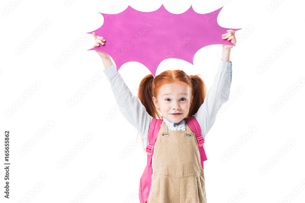 Adorable smiling schoolgirl holding blank speech bubble isolated on white Adorable smiling schoolgirl holding blank speech bubble isolated on white