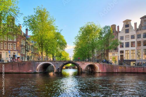 Bridge over the Leidse canal at the Patricians' or Lords' canal (Herengracht) in Amsterdam in spring photo