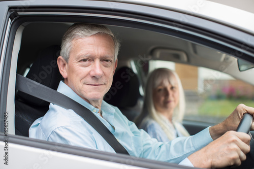 Portrait Of Smiling Senior Couple On Car Journey Together © Daisy Daisy