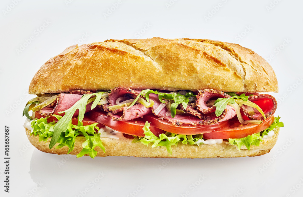 Baguette sandwich with roast beef and vegetables Baguette sandwich with roast beef and vegetables