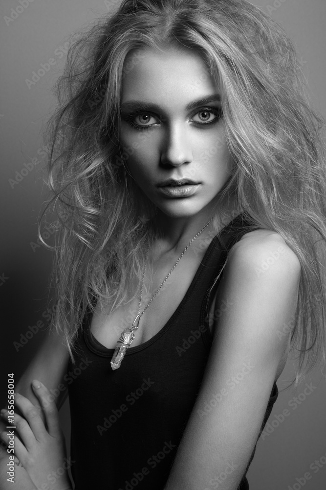 Portrait of young beautiful girl with blonde hair. Fashion photo Hairstyle. Make up. Vogue Style. Black and white photo Portrait of young beautiful girl with blonde hair. Fashion photo Hairstyle. Make up. Vogue Style. Black and white photo