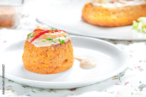 Delicious spanish Fish cake. Hake cake with tuna, tomato, shrimps, chive and salad cream.