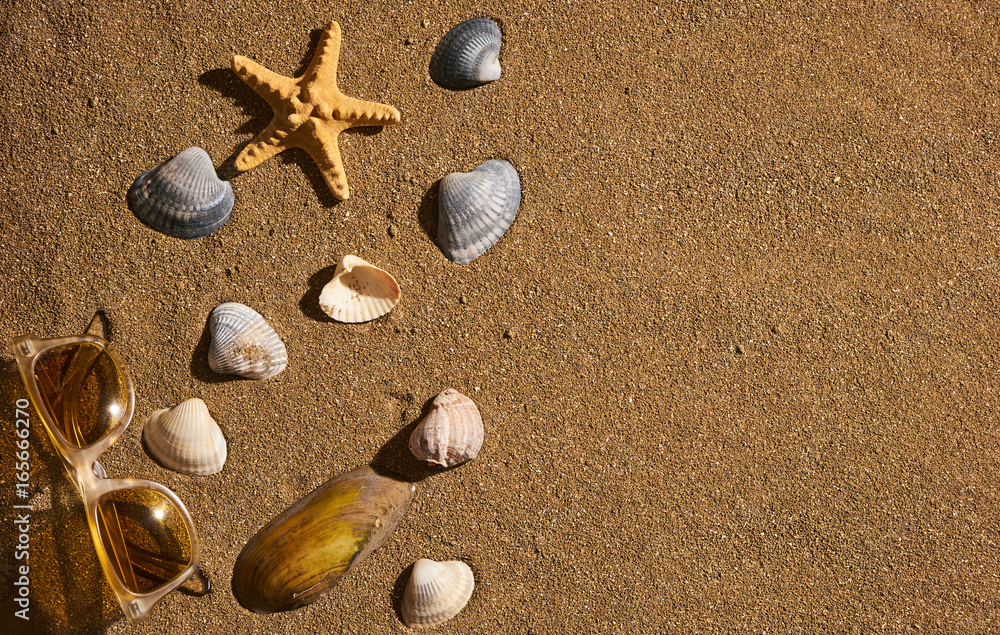 Starfish with sun glasses on a beach sand, vacation and summer time concept. Summer background with copy space. Starfish with sun glasses on a beach sand, vacation and summer time concept. Summer background with copy space.