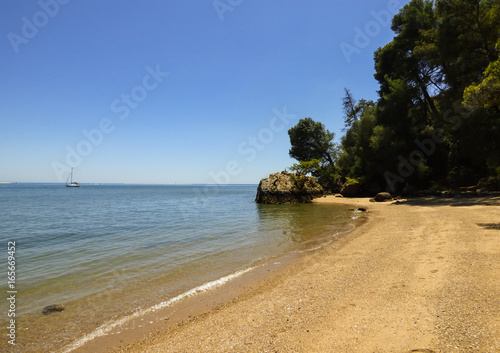 Beach landscape with transparent waters at Natural Park of Arrabida in Setubal, Portugal photo