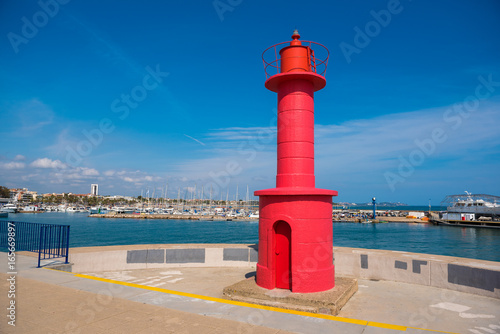 Red lighthouse in Cambrils, Catalunya, Spain. Copy space for text. photo