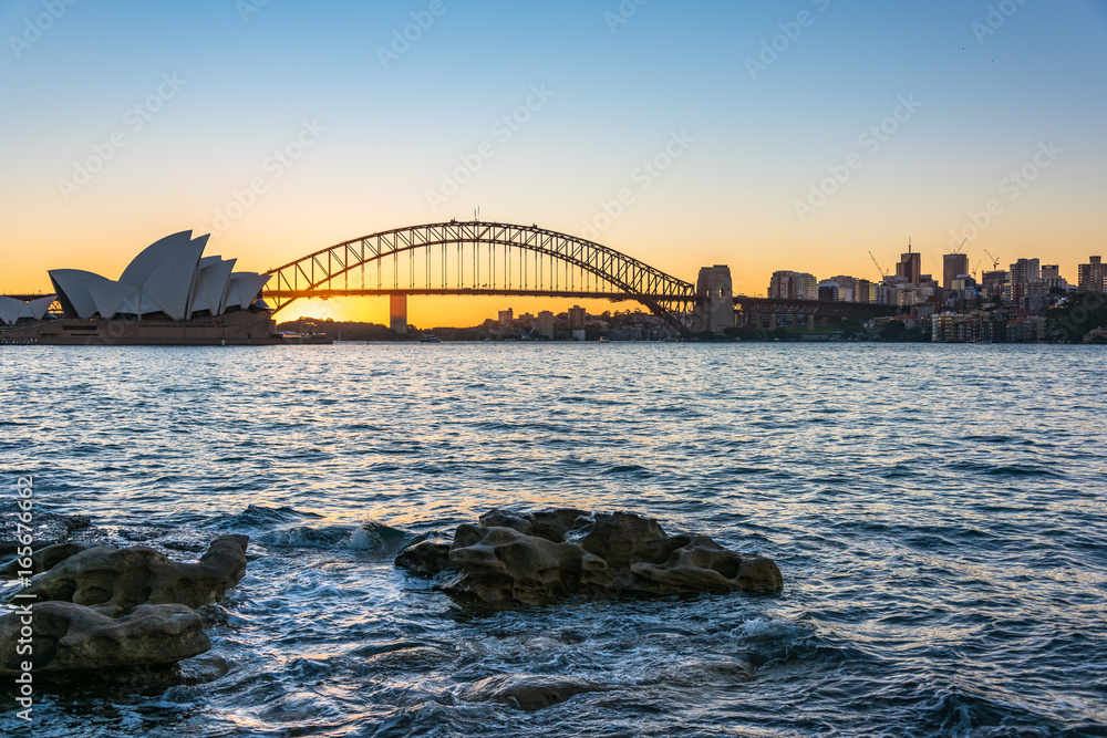 Sydney Harbour Bridge and cityscape at sunset