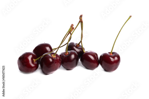 Ripe, washed appetizing and tasty bright red cherries on a white isolated background