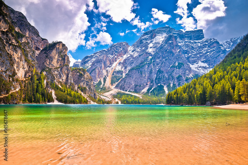 Lago di Braies turquoise water and Dolomites Alps view photo